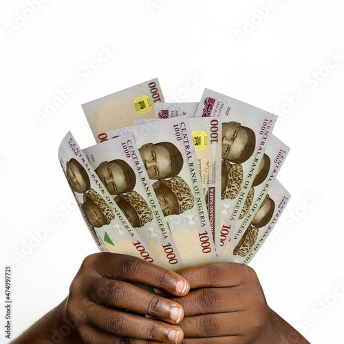 Black hands holding 3D rendered 1000 Nigerian naira notes. closeup of Hands holding Nigerian currency notes