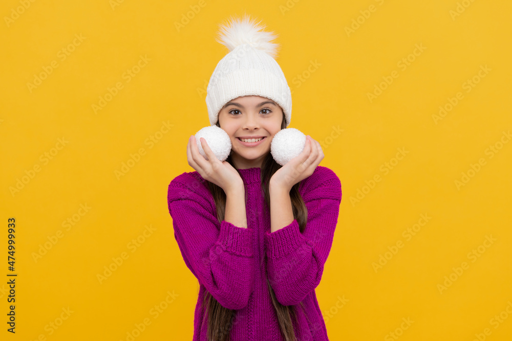 happy new year. happy child in winter hat. kid with decoration balls.