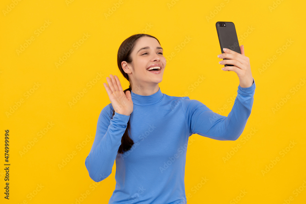 happy girl gesturing hello to on smartphone while video call, vlog happy girl gesturing hello to on smartphone while video call, vlog