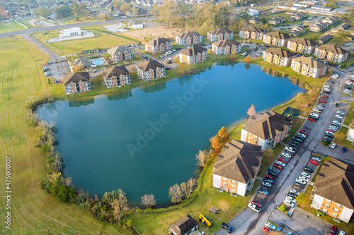 Aerial autumn scene the Denham Springs small town apartment complex near pond in Louisiana USA