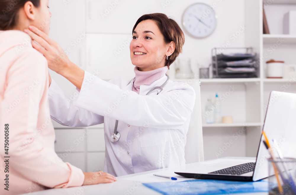 Fototapeta premium Teenage girl has come to hospital to therapist for survey of condition of health