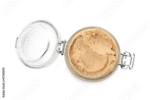 Delicious meat pate in glass jar isolated on white, top view