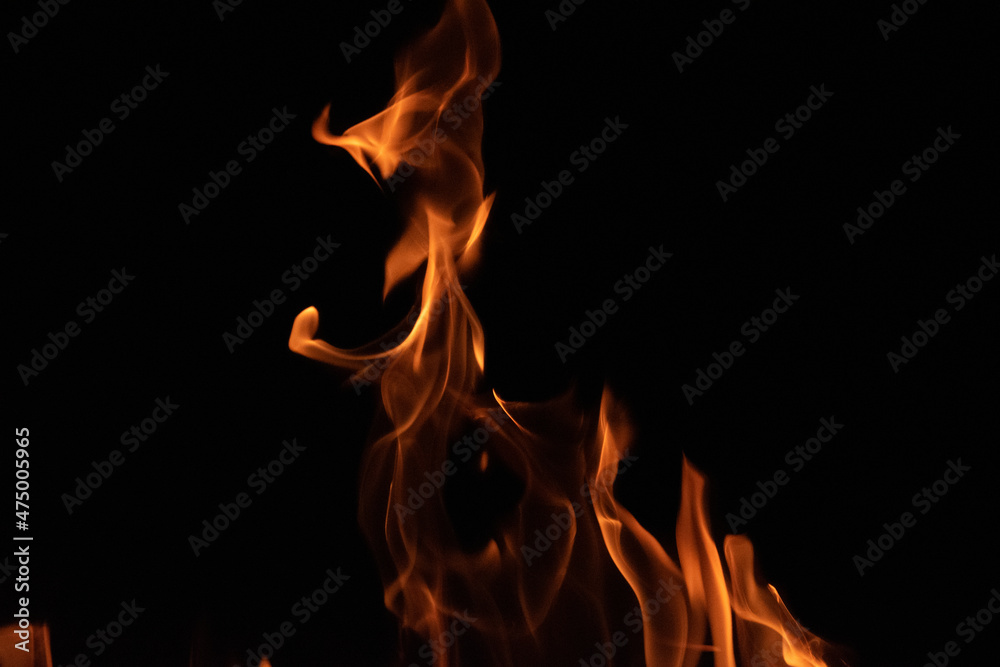 Fire flames on black background. lights on a black background. Fire flames on black background. lights on a black background.