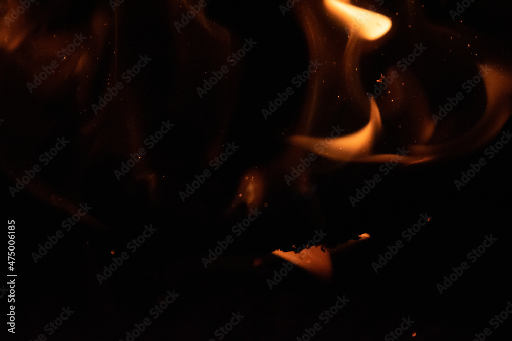 Fototapeta premium Fire flames on black background. lights on a black background.