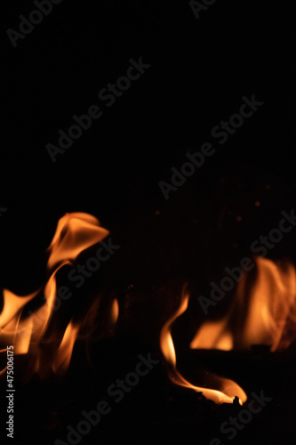 Fire flames on black background. lights on a black background. © Likhit Wongphen