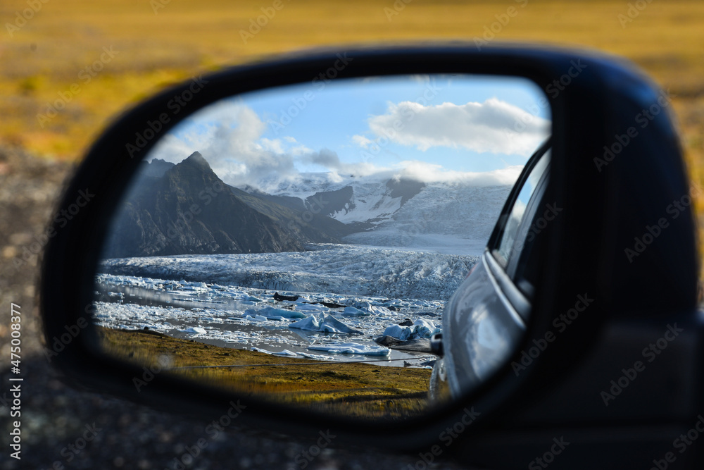 Fjallsárlón glacier and its glacial lagoon and icebergs in a rear-view mirror, Vatnajökull National Park, South Iceland