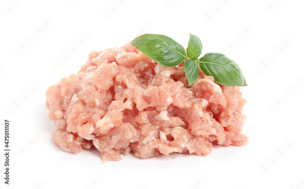 Pile of raw chicken minced meat with basil on white background Pile of raw chicken minced meat with basil on white background