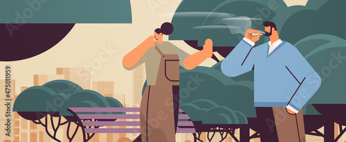man with cigarette discussing with woman in park passive smoking bad habits unhealthy lifestyle nicotine addiction