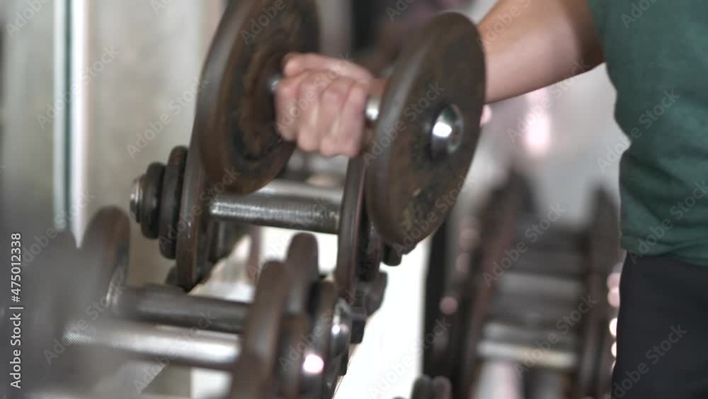 Set, a rack of dumbbells of different sizen for training, close-up. Set, a rack of dumbbells of different sizen for training, close-up.