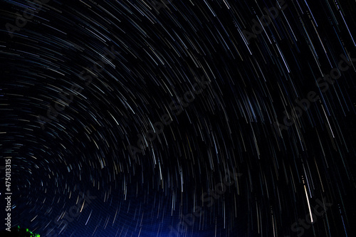 Abstract blur of Light trals star orbit on sky, for background photo