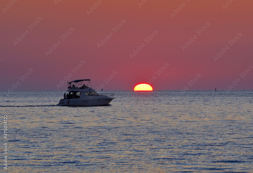Naklejka premium Ships in the Black Sea at sunset