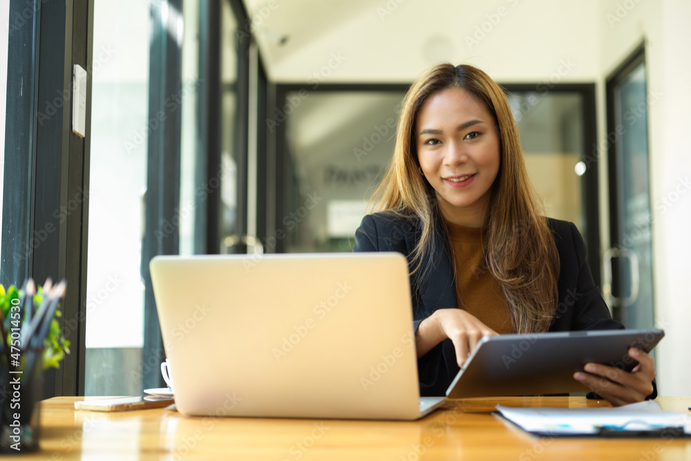 Female business employee working at her desk Female business employee working at her desk