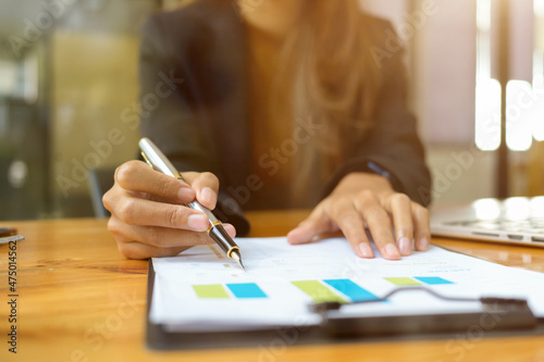 Female financial consultant examines a financial data report