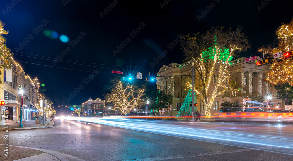 Fototapeta premium Panoramic Picture of the Main Downtown Street With the Georgetown Square Lit up and decorated for the Holidays