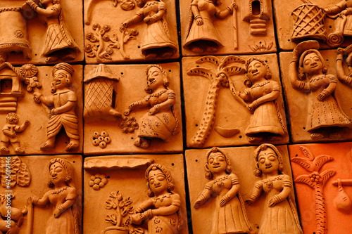 Pune , 11 December 2021: Terracotta tiled artwork at Handicraft Fair in Pune. Beautiful terracotta carving hindu Gods figure on the Tile, relief art. photo