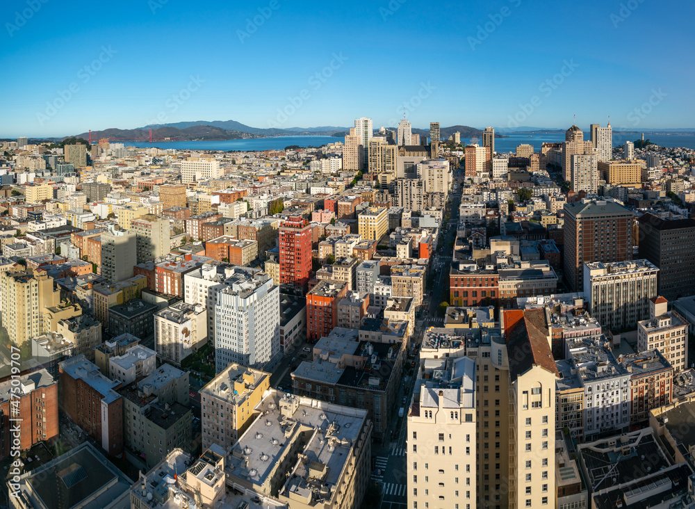 Aerial View of the Buildings in Downtown San Francisco with The Golden Gate Bridge in the Background