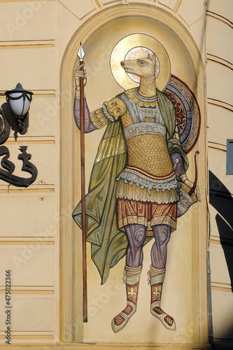 Saint Christopher with dog head on facade of a building, Lviv, Ukraine photo