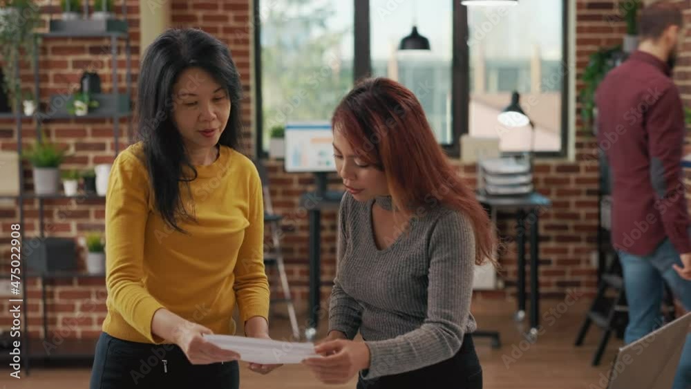 Team of asian women analyzing graphs on paper and tablet to create marketing project, brainstorming strategy ideas for development and business growth. Successful and creative partnership Team of asian women analyzing graphs on paper and tablet to create marketing project, brainstorming strategy ideas for development and business growth. Successful and creative partnership