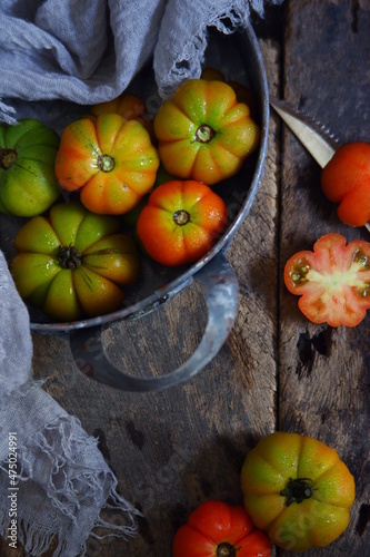 fresh tomatoes in a rustic tray
