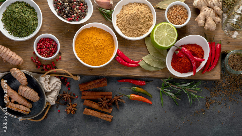 Assortment of spices on gray background. Assortment of spices on gray background.