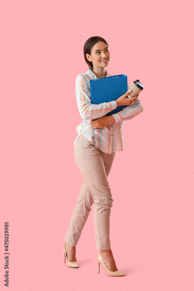 Beautiful young woman with folder and coffee on color background Beautiful young woman with folder and coffee on color background