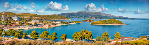 Panoramic seascape of Ionian sea with Corfu island on background. Wonderful spring view of Ksamil village. Spectacular outdoor scene of Albania, Europe. Traveling concept background.