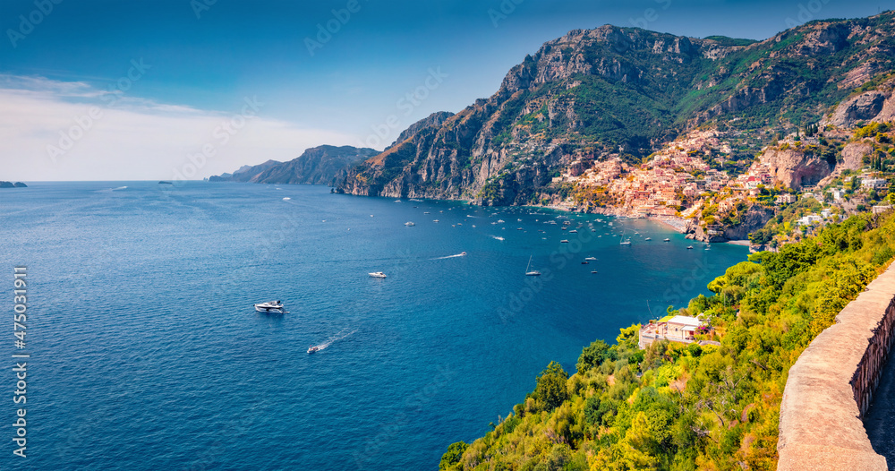 Sunny summer view of popular tourist destination Positano town. Colorful morning view of Mediterranean coast of west Italy, Europe. Traveling concept background.