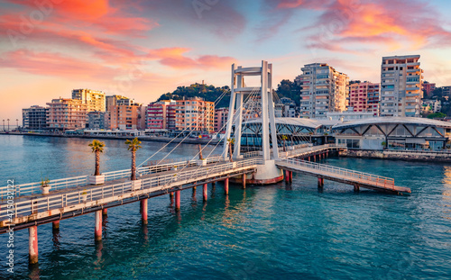 Wonderful sunrise in Durres port, city on Adriatic Sea in western Albania, Europe. Stunning Adriatic seascape. Incredible spring scene of Albania. Traveling concept background. photo