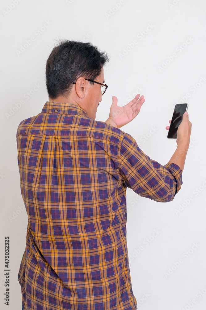 man using a mobile phone making a video call man using a mobile phone making a video call