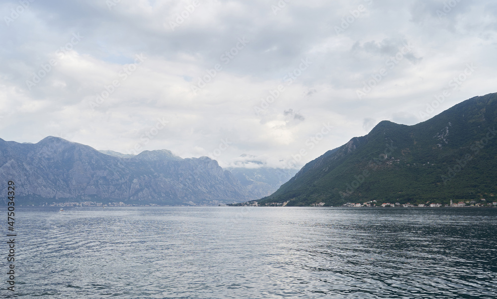 Seascape with mountains and rainy weather in Montenegro
