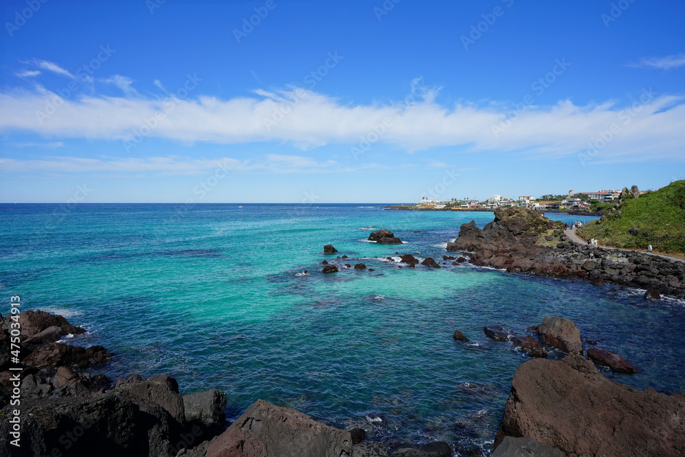 a seaside walkway and clear blue sea a seaside walkway and clear blue sea