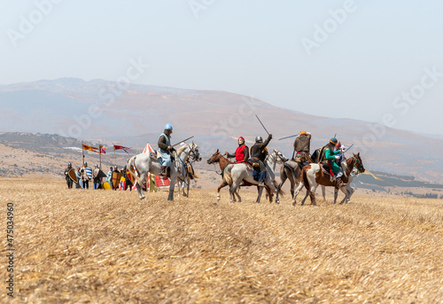 Horse and foot warriors - participants in the reconstruction of Horns of Hattin battle in 1187, are on the battle site, near TIberias, Israel photo