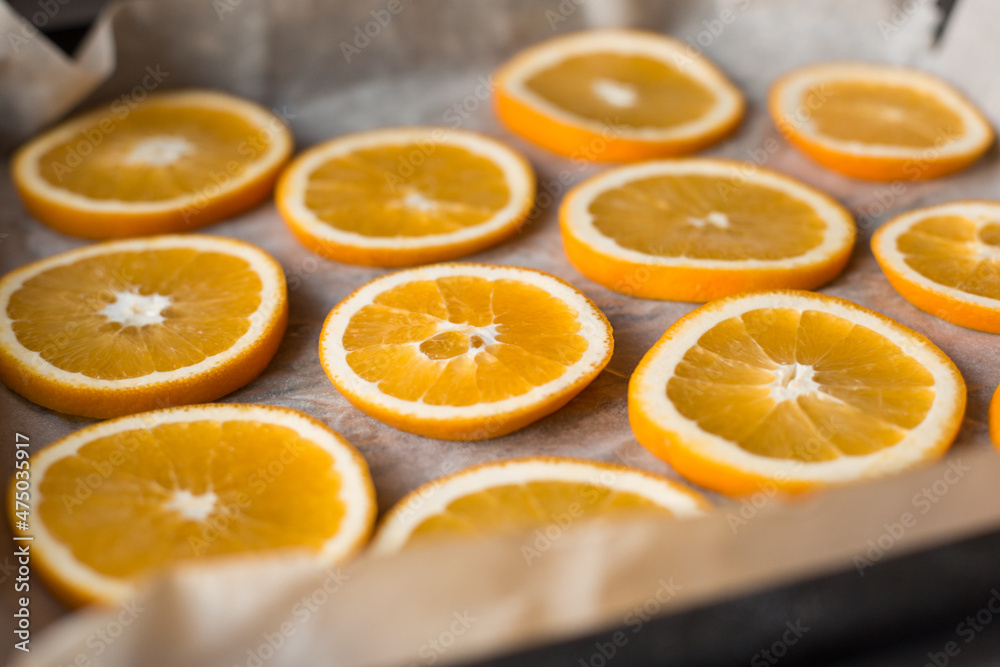 Oranges on a dish prepared for drying. Bright juicy orange slices. Fruit Oranges on a dish prepared for drying. Bright juicy orange slices. Fruit