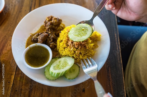 Beef Biryani or Curried rice and beef - Thai-Muslim version of Indian biryani, with fragrant yellow rice and beef