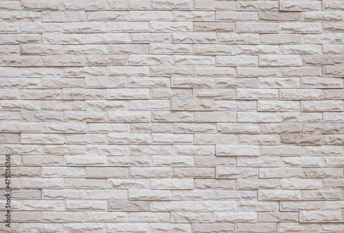 Cream and beige brick wall texture background. Brickwork and stonework flooring interior