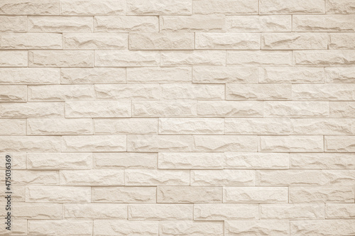 Cream and beige brick wall texture background. Brickwork and stonework flooring interior