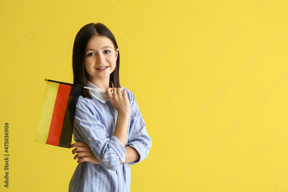 Pupil of language school with German flag on color background Pupil of language school with German flag on color background