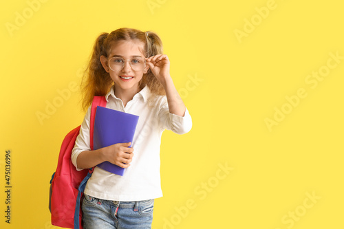 Little school girl on color...