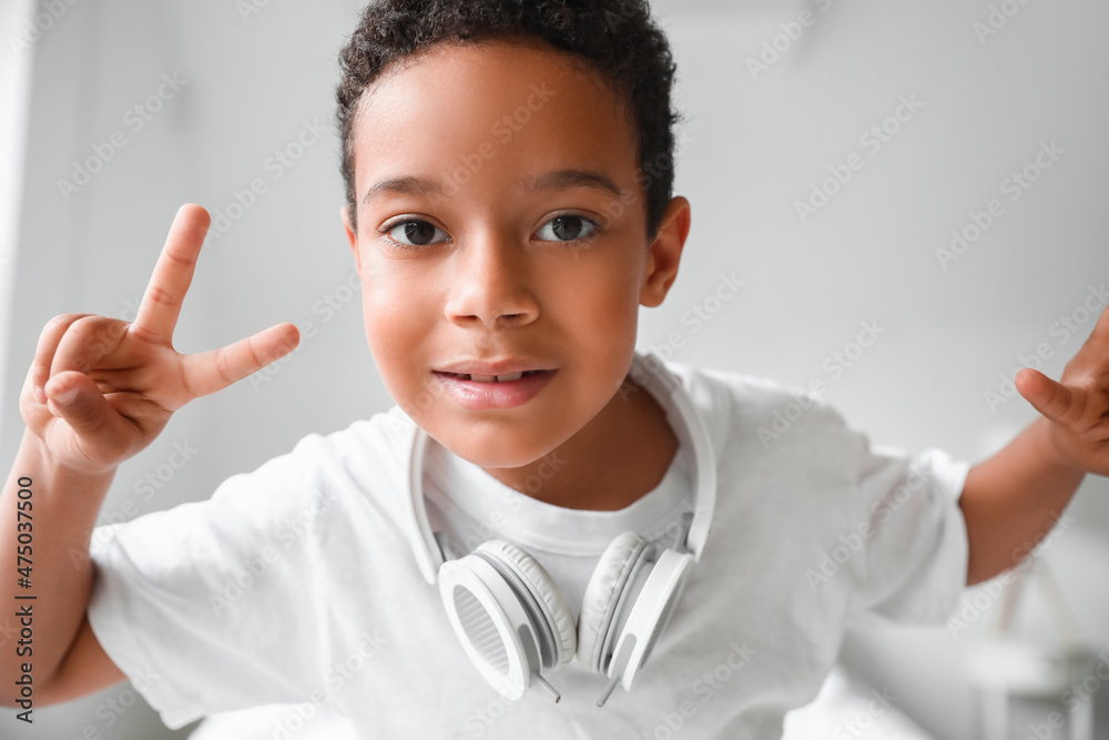 Dancing African-American boy in bedroom Dancing African-American boy in bedroom