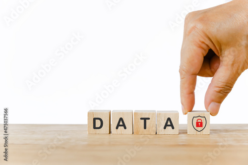 concept of data security, wooden cubes with hand holding protect shield symbol and data word on cube isolated background for work safety concept, hazards, protections personal information