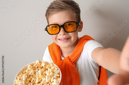 Little boy in eyeglasses wi...