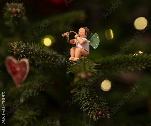 Vintage wooden angel with Christmas clothes, traditional figurine of Christma...