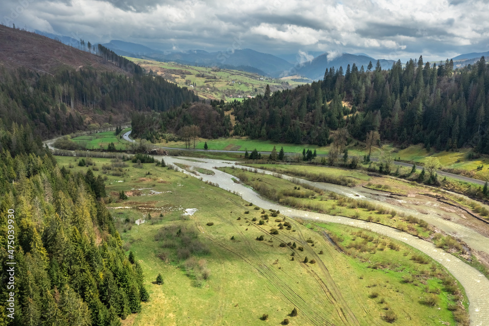Obraz premium Aerial view of the forest and mountains in the Carpathians, beautiful landscape. Tourism, travel, Ukraine
