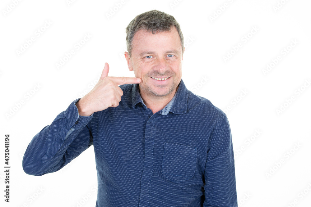 handsome middle aged man is waving his hand towards him happy and smiling handsome middle aged man is waving his hand towards him happy and smiling