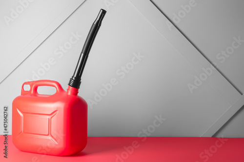 Plastic jerrycan on grey background photo