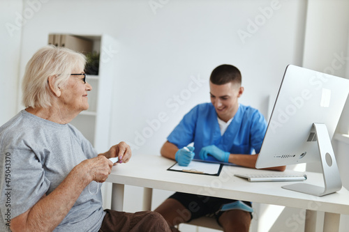 elderly woman patient is examined by a doctor health care