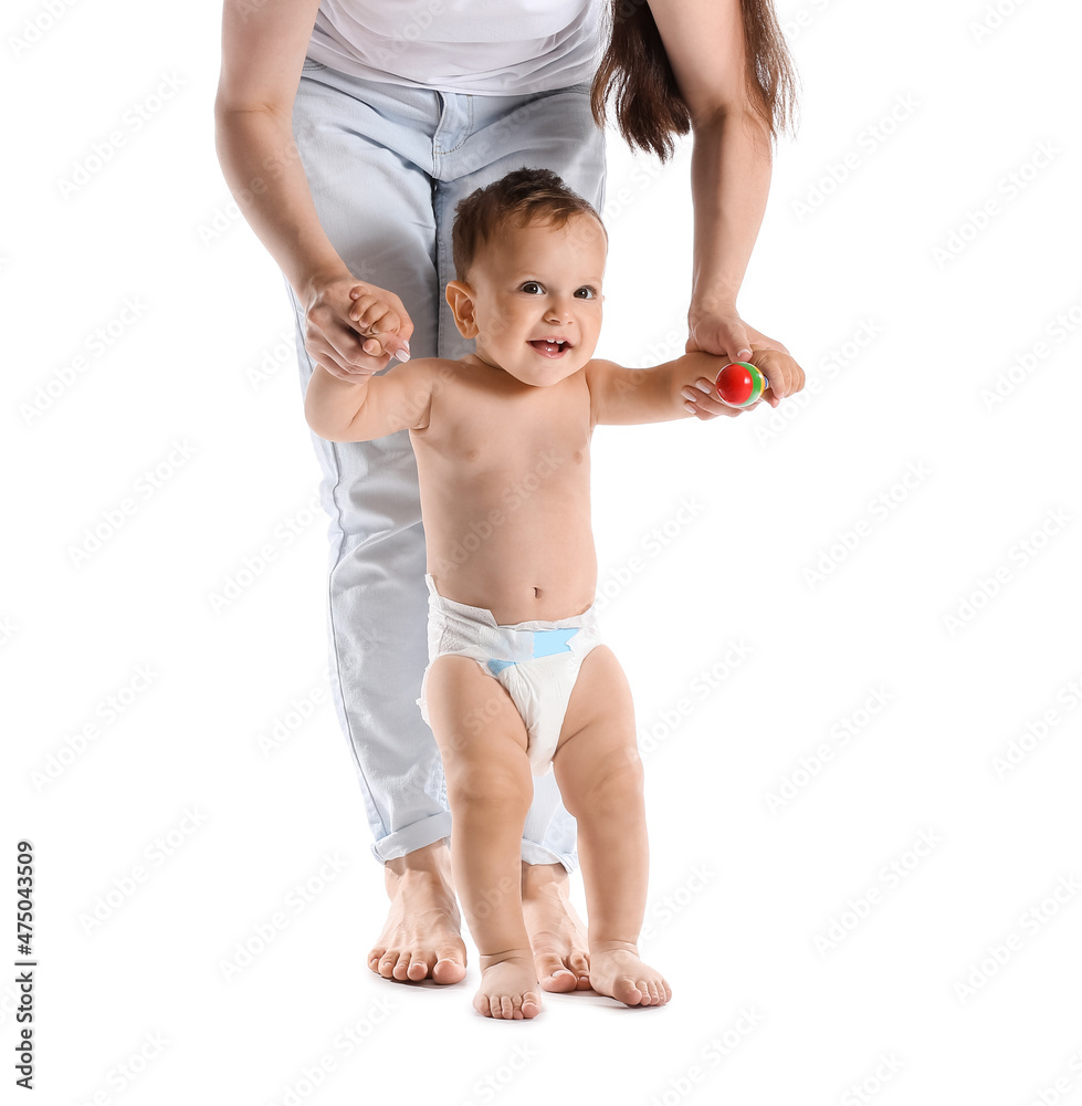 Little baby boy learning to walk with his mother on white background Little baby boy learning to walk with his mother on white background