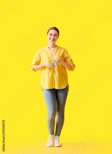 Young woman with key from h...