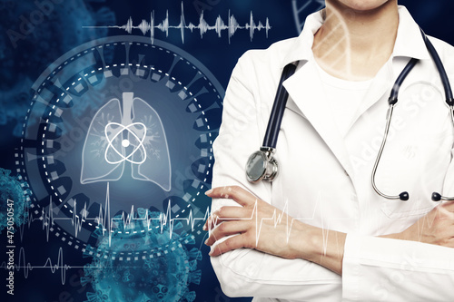 Close up of female doctor with abstract glowing lung interface with virus outline on dark background. Medicine, pandemic and healthcare concept. Double exposure.