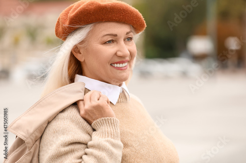 Fashionable mature woman in...